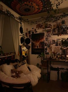 a living room filled with furniture and lots of pictures on the wall next to a window