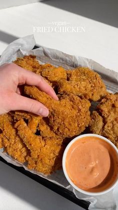 fried chicken sticks with dipping sauce on the side