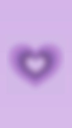 a heart shaped object on a purple background