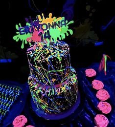 there is a cake with neon lights on it