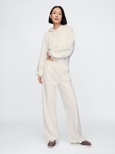 Soft fleece knit wide-leg sweatpants.  Elasticized waist.  Front slant pockets.  Seam at front.  Mid rise.  Straight silhouette with a relaxed fit.  Wide leg.  Models wearing Gap Matching Sweat Set, Wide Leg Sweatpants, Sweat Set, Vintage Soft, Petite Size, Feel Like, Heather Grey, Mid Rise, Gap