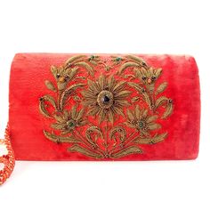 "Stunning glittery luxury clutch expertly hand embroidered on a soft peachy orange crushed velvet by zardozi artisans using antique copper metallic threads and genuine semi precious stones, including amethyst and garnets, to create a dazzling 3D effect. Such lavish details! You will certainly stand out and be noticed wearing this purse. Zardozi means \"gold thread\" or \"writing with gold\". It is an elaborate multidimensional embroidery art form using metallic threads and precious and semi prec Metallic Flowers, Embellished Purses, Classic Wreath, Neutral Accessories, Peachy Orange, Embellished Clutch, Luxury Clutch, Velvet Clutch, Orange Velvet