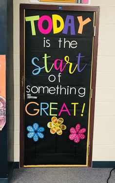 a classroom door decorated with magnets and writing that says today is the start of something great