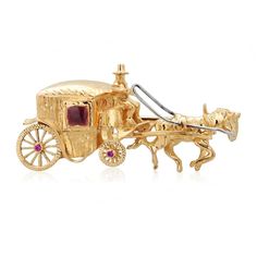 This exquisite Italian brooch is a masterpiece of vintage jewelry design, crafted from luxurious 18-karat yellow gold. The brooch features an enchanting 'Horse and Carriage' motif, beautifully detailed to capture the elegance and romance of a bygone era. It weighs approximately 4.5 pennyweights (dwt), combining substantiality with a delicate artistry. The brooch measures 1-5/8 inches in width, making it a statement piece while still being versatile enough to wear on various occasions. The design intricately depicts a horse in mid-stride, pulling a classic carriage. Both elements are meticulously sculpted, showcasing the skill of Italian craftsmanship with fine lines and textured finishes that give a dynamic and realistic appearance. Adding to its allure, the brooch is embellished with a se Carriage Lights, Horse Harness, Horse And Carriage, Horse Carriage, Italian Craftsmanship, Bygone Era, Vintage Italian, Vintage Jewelry, Jewelry Design