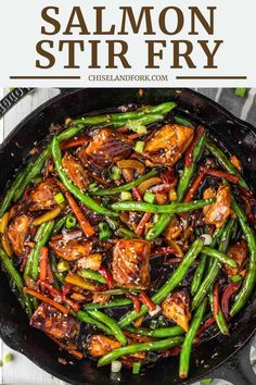 chicken stir fry in a skillet with green beans and carrots on the side