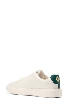 This sleek leather sneaker with clean lines inspired by classic tennis styles has rubber caps at the toe and heel for added traction. Round toe Lace-up style Removable cushioned footbed Leather upper/textile lining/synthetic and rubber sole Imported Classic Green Sneakers With Vulcanized Sole, Green Leather Sneakers With Embossed Logo, Casual Green Sneakers With Embossed Logo, Classic Green Sneakers With Perforated Toe Box, Green Low-top Sneakers With Rubber Heel Cap, Green Sporty High-top Sneakers With Rubber Heel Cap, Sporty Green High-top Sneakers With Rubber Heel Cap, Green High-top Sneakers With Rubber Heel Cap, Green Casual Sneakers With Rubber Heel Cap