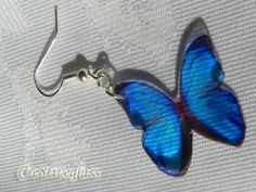 These beautiful Blue Morpho hand crafted resin butterfly earrings would add a touch of summer to any outfit The size butterfly is 1in in diameter This little beauty move's with you and they sparkle in the light and would make a delightful gift for any occasion They are made from resin so they are light as a feather Beautifully packaged for postage to anywhere in the world *Custom Orders a speciality*...Just send me a message and I will be more than happy to fulfill your request for you Postage i Blue Resin Jewelry For Summer, Blue Butterfly Jewelry With Butterfly Print, Blue Butterfly Print Jewelry As A Gift, Blue Butterfly Print Jewelry For Gifts, Blue Jewelry With Butterfly Print For Gift, Handmade Blue Butterfly Earrings, Blue Butterfly Charm Earrings For Gift, Blue Butterfly Earrings Gift, Blue Butterfly Earrings As Gift