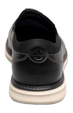 Clean topstitching lends handsome style to this sleek slip-on fitted with a cushioned footbed and shaped by a classic moc toe. Synthetic upper and lining/rubber sole Imported Black Moc Toe Slip-ons With Cushioned Footbed, Comfortable Black Business Slip-ons, Black Moc Toe Slip-ons With Stitched Sole, Casual Leather Slip-resistant Loafers, Modern Leather Slip-ons With Arch Support, Casual Black Slip-resistant Loafers, Modern Leather Slip-ons With Slip-resistant Sole, Modern Leather Slip-resistant Slip-ons, Casual Moc Toe Slip-resistant Loafers