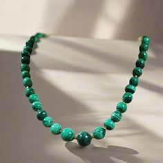 This elegant necklace is crafted from 18k gold and adorned with Malachite stones for a sophisticated, timeless look. The gold provides a luxurious and modern touch, while the Malachite stones add a hint of color. Perfect for special occasions and everyday wear. Evil Eye Stone, Malachite Stone, Elegant Necklace, Fine Jewelry Collection, Elegant Necklaces, Pendant Rings, Beaded Necklaces, Stone Necklace, Earring Necklace