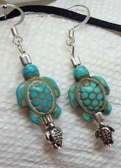 "Handmade Jewelry Designs by WEEDs is handmade and created using high-quality materials designed to last. One Of A Kind Jewelry Pieces and more! Jewelry hypoallergenic nickel free earrings gifts for her! Silver Mama, baby turtle earrings. The Turtle spirit animal is in touch with Mother Nature. The turtle spirit animal understands that it takes time to accomplish its goals. Turtle spirit people appear to have an impenetrable shell when in reality they can be emotional and sensitive. This spirit Unique Hypoallergenic Adjustable Earrings, Handmade Small Green Jewelry, Small Handmade Green Jewelry, Nickel Free Small Adjustable Jewelry, Nickel-free Turquoise Jewelry For Crafting, Adjustable Nickel-free Earrings For Gifts, Adjustable Hypoallergenic Earrings As Gift, Hypoallergenic Adjustable Earrings As A Gift, Adjustable Hypoallergenic Earrings For Gift