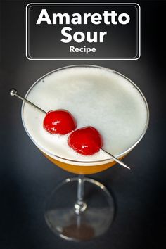 two cherries sit on top of a drink in a glass with the words amaretto sour recipe