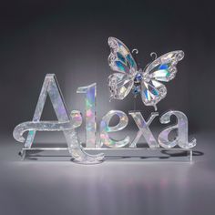 an acrylic sign with butterflies on it and the word ajax spelled in white letters