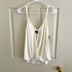 New With Tags- Lulu’s White Crossbody Camisole Top Size Medium I Love This Top But I’m Too Busty For It After Kids White Tank Top With Built-in Bra For Day Out, White Camisole With Built-in Bra For Night Out, White Vest Top For Night Out, White Chic Tank Top With Built-in Bra, White Cami Tank Top For Night Out, Chic White Tank Top With Built-in Bra, White Camisole Tank Top For Night Out, White Tank Camisole For Night Out, White Casual Camisole For Night Out