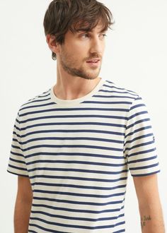 Cut in our quality lightweight cotton, the new PLOUIDER striped t-shirt for men is an instant classic. The crew neckline and trim fit make it perfect for layering. Order a size up for a more relaxed fit. Made in Saint-James, Normandy, France. 100% Cotton. Classic Navy Tops With Horizontal Stripes, Navy Classic Top With Horizontal Stripes, Classic Navy Top With Horizontal Stripes, Classic Cotton T-shirt With Horizontal Stripes, Classic Striped Cotton T-shirt, Navy Horizontal Stripe Crew Neck Top, Classic Striped Crew Neck T-shirt, Navy Cotton Nautical T-shirt, Navy Nautical Cotton T-shirt