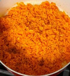 a pot filled with rice on top of a stove