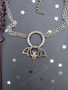 PLEASE read my shop announcement before placing an order so you know what to expect right now. Plus, when ordering from outside Europe, don't forget to provide a phone number for the courier to ensure the fastest and smoothest delivery. Witchy bat choker O ring necklace. Perfect for Samhain / Halloween, or your witchy everyday Short necklace, total length is 13 inches, about 43 cm. It fastens with a strong lobster clasp, and has a 2 inches, 5cm., extension chain. I can make this in your desired Witchy Metal Jewelry For Halloween, Vampire Style Choker Necklace For Halloween, Halloween Vampire Choker Necklace, Vampire Style Halloween Choker Necklace, Handmade Halloween Choker Jewelry, Adjustable Vampire Jewelry For Halloween, Handmade Vampire Jewelry For Halloween, Metal Halloween Choker Jewelry, Halloween Metal Choker Jewelry