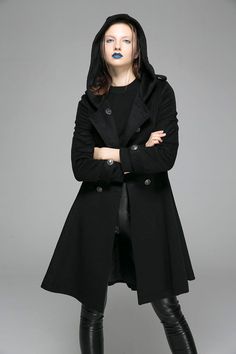 "This black fit & flare wool hooded coat commands attention. With military styling, the short length swing coat is an absolute must-have this winter. Perfect for all occasions, you'll find that you'll wear this coat again and again. From the short length styling to the cozy hood, this double breasted coat has clean lines and a sleek cut. The classic black hue only adds to the look and feel of this woman's outerwear. It will make any woman feel feminine and stylish. DETAILS: * 60% wool blend, Wool Coat Black, Winter Coat Short, Hooded Wool Coat, Tailored Clothes, Fitted Coat, Military Coat, Thick Sweaters, Coat Winter, Woolen Coat