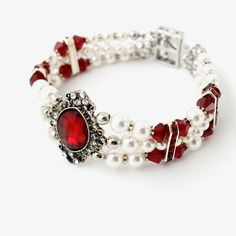 Victorian Style Red Crystals and White Pearls elegant bracelet for every women who desires to look beautiful and attractive. Perfect for your wedding or common wear. The bracelet made of: ...Pear Red Siam Premium Quality Crystal and antique silver plated drop encrusted with rhinestone Clear Premium Quality Crystals (1 1/2" x 7/8", 38mm x 22mm)... ...round White Premium Quality Pearls... ...bicone Red Siam Premium Quality Crystal... ...silver plated spacer bead with Red Siam Premium Quality Cryst White Pearl Bracelet For Wedding And Valentine's Day, White Pearl Wedding Bracelet For Valentine's Day, White Pearl Wedding Bracelet, Adjustable Pearl Bracelet For Wedding On Valentine's Day, Elegant Crystal Bracelet For Wedding On Valentine's Day, Elegant Stretch Bangle Bracelet For Wedding, White Beaded Bracelets For Wedding On Valentine's Day, Red Adjustable Beaded Bracelets For Formal Occasion, Elegant White Pearl Bracelet For Valentine's Day