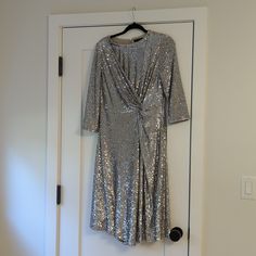 Beautiful Size 10 Asymmetrical Hem Silver Sequin Dress. 3/4 Sleeve Shortest Point Hits At The Knee Elegant Evening Dress With 3/4 Sleeves, Elegant 3/4 Sleeve Evening Dress, Sequined Evening Dress With Asymmetrical Hem, Evening Dress With Sequins And Asymmetrical Hem, Sequin Dress With Asymmetrical Hem For Evening, Elegant Sequin Dress With Asymmetrical Hem, Elegant Dresses With Sequins And Asymmetrical Hem, Formal Dress With Asymmetrical Hem For Party Season, Fitted Sequin Dress With 3/4 Sleeves