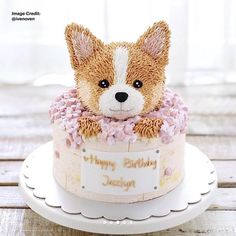 there is a small cake with a dog on it