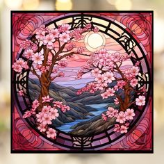 a stained glass window with pink flowers and trees in the center, against a blurred background