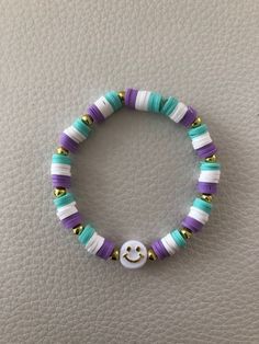 a beaded bracelet with a smiley face on it