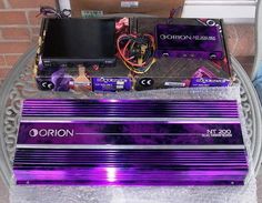 purple and black electronic equipment sitting on top of a table