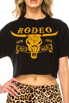 RODEO SHORT SLEEVE CROP TOP - Trailsclothing.com Trendy Short Sleeve T-shirt For Rodeo, Rodeo Screen Print Crew Neck Top, Black Western Style T-shirt For Rodeo, Model Standing, Black Graphic Print T-shirt For Rodeo, American Made Clothing, Short Sleeve Graphic T-shirt For Rodeo, Graphic Print Top, Short Sleeve Crop Top