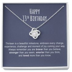 a necklace with an inscription on it that says happy 13th birthday, and is in a box