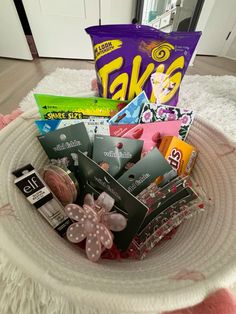 a basket filled with lots of different types of candy