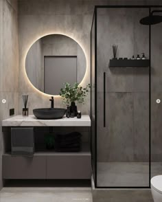 a bathroom with a round mirror above the sink