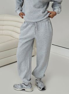 Sweatpants Ruched at waist, adjustable drawstring, two front pockets, branded logo at front, cuff at ankle Non-stretch material, unlined Princess Polly Lower Impact 52% reclaimed cotton 48% reclaimed polyester Cold gentle machine wash Sweatpants Grey, Cuffed Sweatpants, Cozy Sweatpants, Pink Formal Dresses, Corsets And Bustiers, Long Sleeve Tops Casual, Strapless Tops, Floral Blue Dress, Loungewear Sets