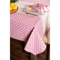 the table is covered with pink and white linens