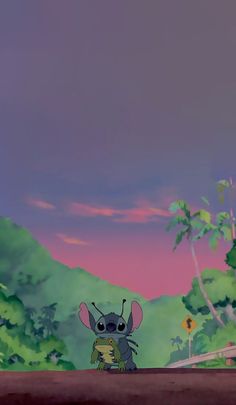 the little mouse is standing in front of some trees and mountains, with a pink sky behind it