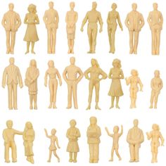 a group of wooden figurines standing next to each other on a white background