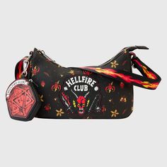 **Now Shipping** This classic Loungefly “baguette” bag carries the Hellfire Club logo, which glows in the dark! The logo repeats as a motif in an all-over pattern across the bag. Flames shoot across the straps, and a detachable coin bag, featuring the winning roll of the dice, creates extra room for storing smaller items. This bag is an officially licensed Netflix product. Dimensions: 8.75”W x 6”H x 2.5”D Material: Faux leather (polyurethane) Features: Bag has adjustable shoulder strap, a detach Stranger Things Collection, Stranger Things Hellfire Club, Stranger Things Hellfire, The Hellfire Club, Netflix Stranger Things, Hellfire Club, Stranger Things Stuff, Loungefly Bag, Head Off