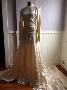 "Custom designed wedding gown from the late 1940's (1948-49) . Made for a woman who was approximately 115- 120 lbs and approximately 5'7\" tall. This gown could have be made by designer Caroline Herrera the workmanship and simple elegance screams her namesake. The icy pink satin is stunning in this gowns design, as is the pleated bustle back. Measurements are; Armpit to armpit Waist Feel free to convo me with any further questions. Thank you for your interest." Vintage Fitted Wedding Dress For Debutante Ball, Vintage Cream Wedding Dress With Fitted Bodice, Vintage Wedding Dress With Fitted Bodice, Vintage Gown With Fitted Bodice For Wedding Night, Cream Vintage Wedding Dress With Fitted Bodice, Fitted Bodice Floor-length Gown For Vintage Events, Floor-length Gown With Fitted Bodice For Vintage Events, Gold Fitted Wedding Dress For Debutante Ball, Fitted Gold Wedding Dress For Debutante Ball