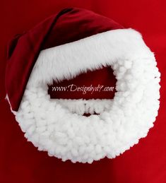 a santa claus hat on top of a red background