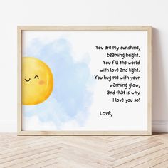 an art print with the words you are my sunshine, behind it is a smiling balloon