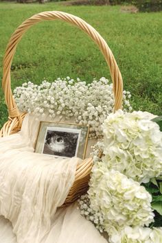 a basket filled with flowers and a photo