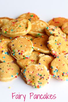 a pile of fancy pancakes with sprinkles on top and the words fairy pancakes above it