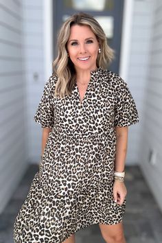 Roar with style in the THML Leopard Lane Puff Sleeve Dress! This v-neck dress features a fierce leopard print, eye-catching puff sleeves, and full lining for all-day comfort. Show off your team spirit and cheer on the Jaguars in this playful and unique dress. Brittney is 5'3" wearing a small 85% Rayon 15% Nylon Imported Hand Wash COld Boat Neck Tops, Graphic Tee Dress, Rust Dress, Capri Blue, Puffed Sleeves Dress, Girls Prints, Solid Dress, Skirt Leggings, Unique Dresses