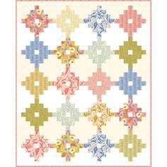 a quilt with many different designs on the front and back, all in pastel colors