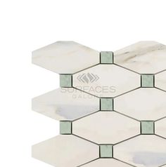 white marble hexagonal tile with green and gray accents on the edges, set against a white background