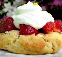 two scones filled with cream and strawberry jam