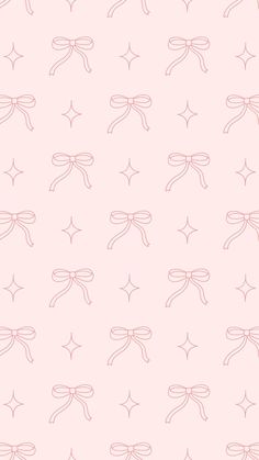 a pink wallpaper with dragonflies on it