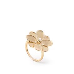 This Marco Bicego ring from the Petali collection features a flower accented by a diamond in the center of the 18kt yellow gold piece of jewelry. Luxury Flower Ring With Single Cut Diamonds, Luxury Flower Shaped Rings With Single Cut Diamonds, Luxury Flower Shaped Ring With Rose Cut Diamonds, 14k Yellow Gold Brilliant Cut Flower Ring, Yellow Gold Diamond Flower Ring With Center Stone, Yellow Gold 14k Brilliant Cut Flower Ring, Elegant Yellow Gold Flower Ring With Brilliant Cut, Formal Yellow Gold Flower Ring With Single Cut Diamonds, Formal Yellow Gold Diamond Flower Ring