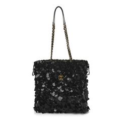 This is an authentic CHANEL Sequin Shopping Tote in Black.This stylish shoulder bag features black sequins throughout, leather threaded gold chain shoulder straps, and a matching Chanel logo on the front.It opens to a black fabric interior. Rectangular Shoulder Bag With Sequins For Night Out, Chic Rectangular Sequined Shoulder Bag, Rectangular Sequin Shoulder Bag For Night Out, Glamorous Evening Shoulder Bag With Sequins, Black Sequin Party Bag, Chic Sequined Shoulder Bag For Everyday Use, Chic Sequined Shoulder Bag, Luxury Evening Shoulder Bag With Sequins, Black Evening Bags With Sequins