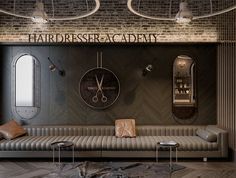 the interior of a hairdresser's academy with two clocks on the wall