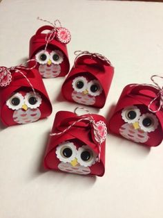 some little red bags with an owl on them